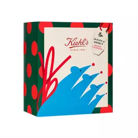 Caja de regalo navidena de Kiehl's con diseno abstracto colorido, logotipo y etiqueta "Since 1851", mostrada como empaque promocional festivo.