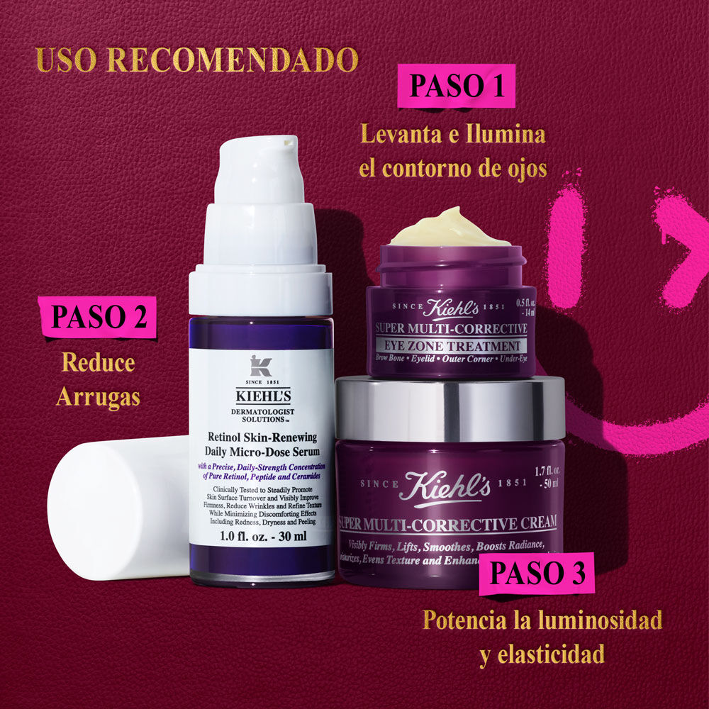 Un grafico titulado "USO RECOMENDADO" muestra tres productos de cuidado de la piel de Kiehl's sobre un fondo morado oscuro con elementos graficos rosa brillante a la derecha: un tarro morado mas pequeno de "Kiehl's Super Multi-Corrective Eye Zone Treatment" para el "PASO 1 Levanta y Ilumina Visiblemente el Area Debajo de los Ojos", una botella blanca y morada de "Kiehl's Retinol Skin-Renewing Daily Micro-Dose Serum" para el "PASO 2 Reduce Visiblemente las Arrugas", y un tarro morado mas grande de "Kiehl's Super Multi-Corrective Cream" para el "PASO 3 Potencia la Luminosidad y Elasticidad".